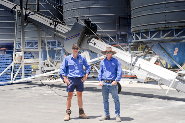 Agworld client, Dalby Rural and Steve McVeigh standing by packaging equipment